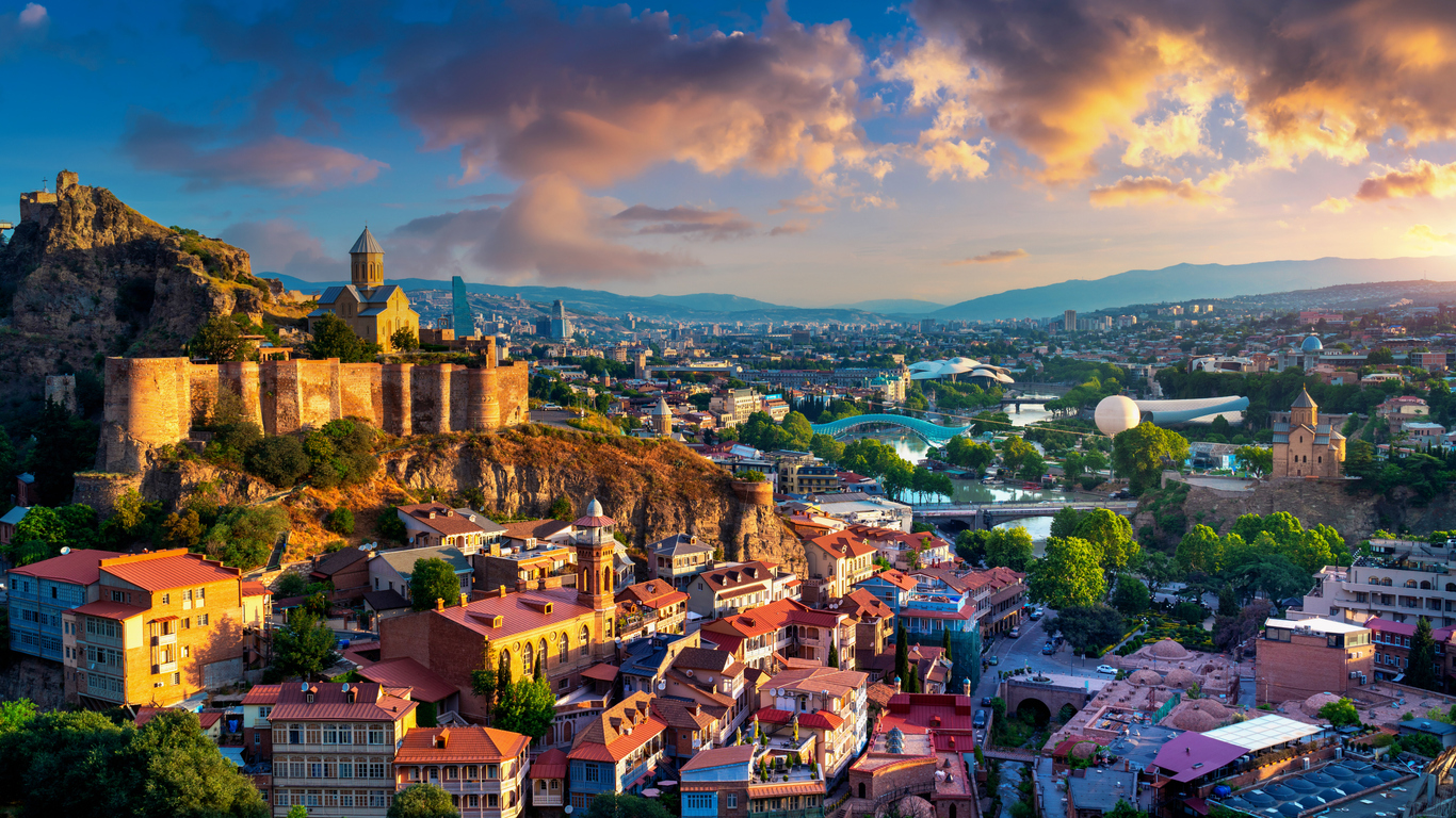 Scenic Top View Of Tbilisi, Georgia In Bright Evening Illumination With All  Famous Landmarks, Sightseeings. Dramatic Blue Cloudy Sky Background.  Royalty Free fotografie a reklamní fotografie. Image 65297590.